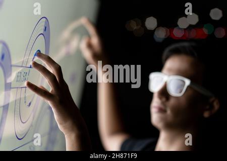 Close up of businessman hand using creative business chart. Innovation, finance, trade, future, ai and technology concept. Double exposure.  Stock Photo