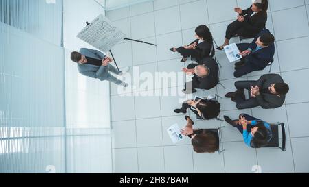 top view. working group discussing working issues at the meeting . Stock Photo