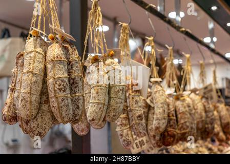 Tuscan salami hanging in a butcher shop in Florence Stock Photo