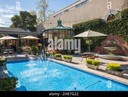 Carmel-by-the-Sea, California, USA. Turquoise pool in the Court of the Fountains, an exclusive Downtown shopping and dining area off Mission Street. Stock Photo