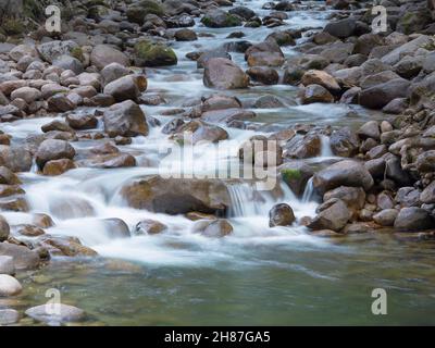 Yosemite National Park, California, USA. View up the boulder-strewn Merced River from the John Muir Trail below Vernal Fall. Stock Photo