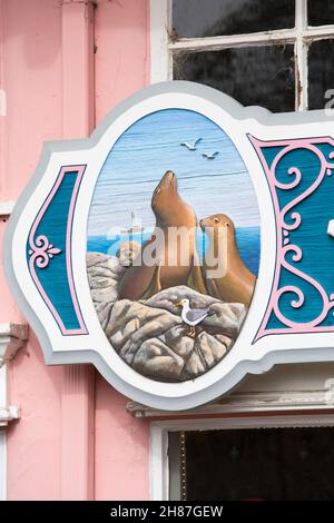 Monterey, California, USA. Appealing illustration depicting local wildlife on façade of a Fisherman's Wharf gift shop. Stock Photo