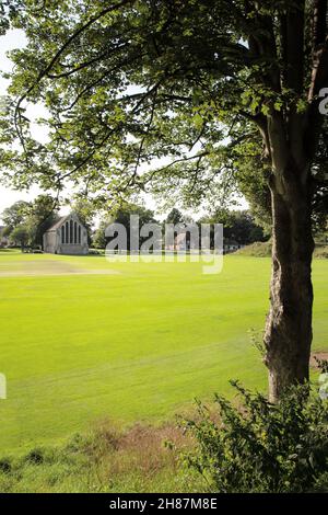 landscape of chichester priory park with the Guildhall building in the background Stock Photo