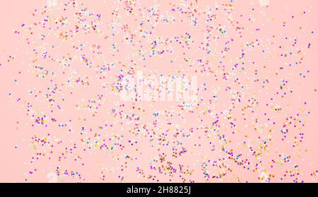 Multicolored confetti glitter on pink background Stock Photo