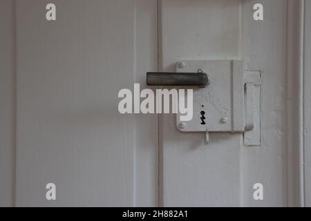 Old vintage metal electricity switch and junction box with exposed conduit  pipes on the surface mounted on a wooden wall alongside a door Stock Photo  - Alamy
