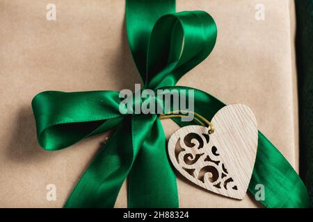 Christmas gift boxe wrapped in craft paper with green ribbon Stock Photo