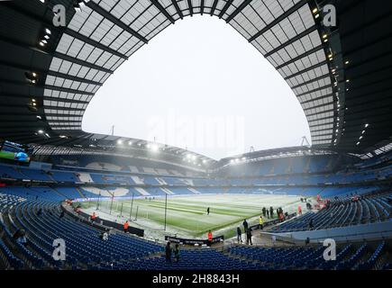 Manchester City head groundskeeper Lee Jackson clears snow from the ...