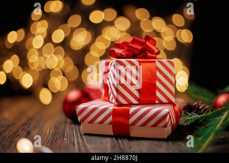 boxes with gifts on the background of Christmas lights. Stock Photo