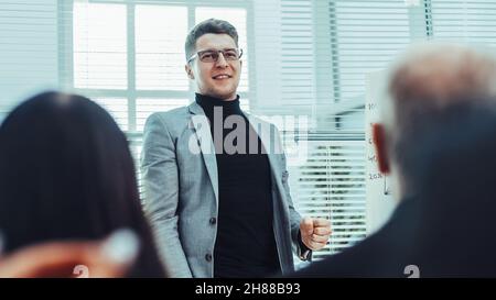 project Manager making a report for the working group Stock Photo