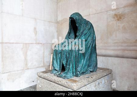 Salzburg, Austria - August 8, 2011 : Die Pieta or Coat of Peace, the sculpture at the southern archway of Salzburg Cathedral created by Prague artist Stock Photo