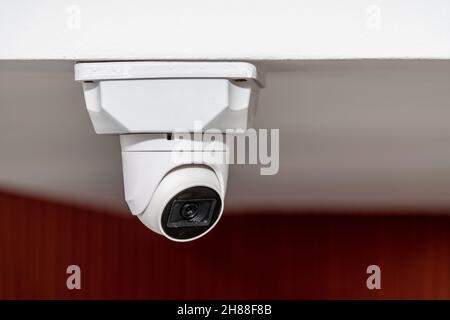 White ceiling mounted security camera with night vision Stock Photo