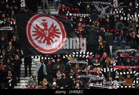 28 November 2021, Hessen, Frankfurt/M.: Football, Bundesliga, Eintracht Frankfurt - 1. FC Union Berlin, Matchday 13 at Deutsche Bank Park. Eintracht fans hold up their fan scarves before the match. IMPORTANT NOTE: In accordance with the regulations of the DFL Deutsche Fußball Liga and the DFB Deutscher Fußball-Bund, it is prohibited to use or have used photographs taken in the stadium and/or of the match in the form of sequence pictures and/or video-like photo series. Photo: Arne Dedert/dpa Stock Photo