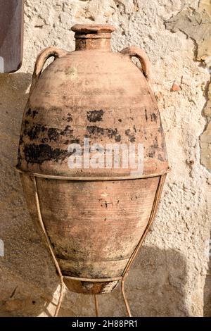 Old Terracotta Amphora with two handles, in the small village of Marzamemi, Syracuse (Siracusa), Sicily island, Italy, Europe. Stock Photo