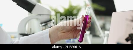 Scientist records receipt of chemical research in laboratory Stock Photo