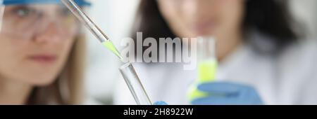 Two researchers conducting chemical research on substance Stock Photo