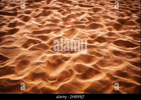 Rippled shiny sand natural pattern at sunset Stock Photo