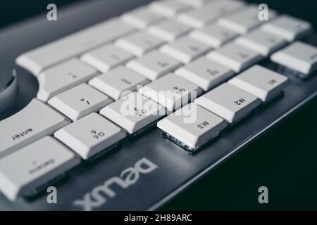 London, UK - 2021.11.27: Product close-up shot of Delux T11 Designer Gaming Keyboard with Custom Keys Group Smart Dial 3 Stock Photo