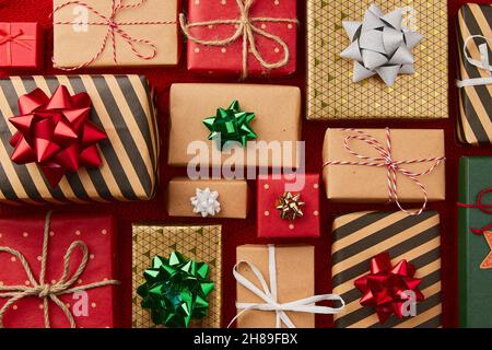 Christmas composition. Gifts presents on red blanket Stock Photo