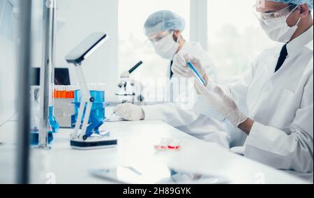 background image scientists are conducting research in the laboratory. Stock Photo