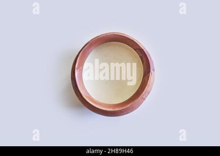 A top view of milk in a clay jug Stock Photo