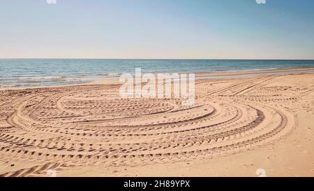 Tire tracks on the beach Stock Photo
