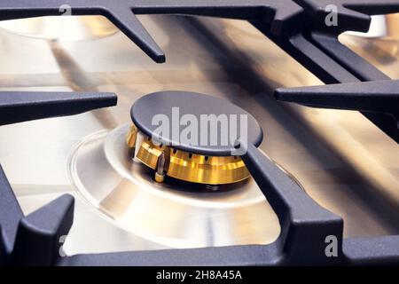 Gas oven hob with gas burners and grate kitchen stove Stock Photo
