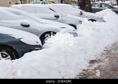 Lublin, Poland - February 13, 2021: Cars parked in heavy snow at Ogrodowa street in winter Stock Photo