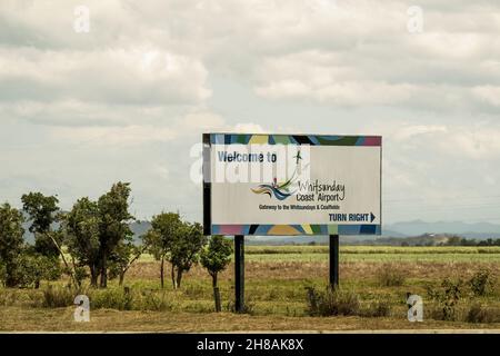 Bruce Highway, Townsville to Mackay, Queensland, Australia - November 2021: Billboard advertising Whitsunday Coast Airport