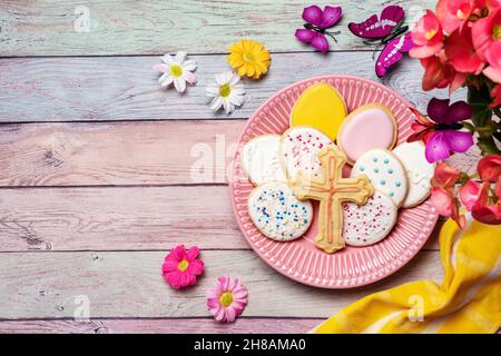 Easter cookies in a plate on pastel background Stock Photo