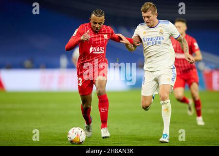 Madrid, Madrid, Spain. 28th Nov, 2021. JULES KOUNDE of Sevilla FC and TONI KROOS of Real Madrid during La Liga football match between Real Madrid and Sevilla FC at Santiago Bernabeu Stadium in Madrid, Spain, November 28, 2021 Credit: Ruben Albarran/ZUMA Wire/Alamy Live News Stock Photo