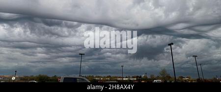 Horizontal view of dramatic storm cloids forming over a shopping center parking lot on Long Island New York. Stock Photo