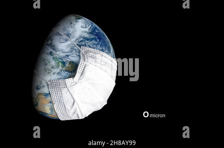 Omicron COVID-19 variant poster, Earth in medical mask isolated on black background looks at corona virus. Globe with protect from coronavirus in oute Stock Photo