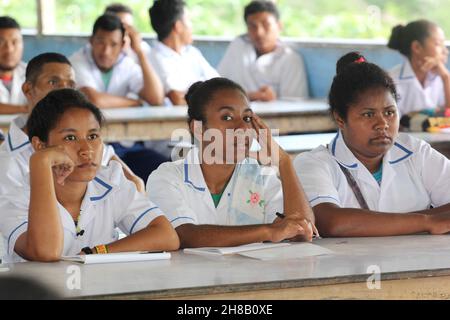 Female students at Kupuiano Secondary School in Central Province, Papua New Guinea listing to a presentation in 2018. Stock Photo