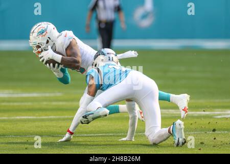 Miami Dolphins free safety Jevon Holland (8) intercepts a pass in the end  zone intended for Houston Texans wide receiver Brandin Cooks (13) during  the first half of an NFL football game