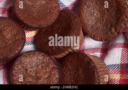 Delicious chocolate cupcakes with baking cloth Stock Photo