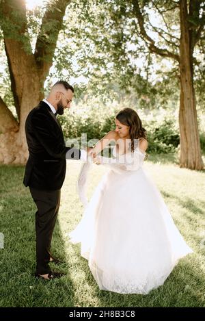 Bride and groom in park Stock Photo