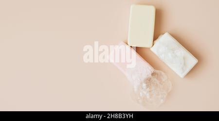 Natural organic handmade soap with large bubbles of foam on pastel background. Health beauty natural products concept.  Stock Photo