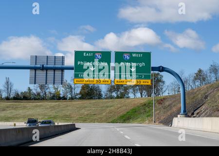Carlisle, PA - Oct. 27, 2021: Route 76 Pennsylvania Turnpike entrance ramp signs for Philadelphia and Pittsburg. Stock Photo