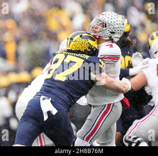 Ann Arbor, Michigan, USA. 27th Nov, 2021. Defensive lineman Aiden Hutchinson from the University of Michigan puts a big hit on Ohio State quarterback CJ Stroud. (Credit Image: © David Donoher/ZUMA Press Wire) Stock Photo