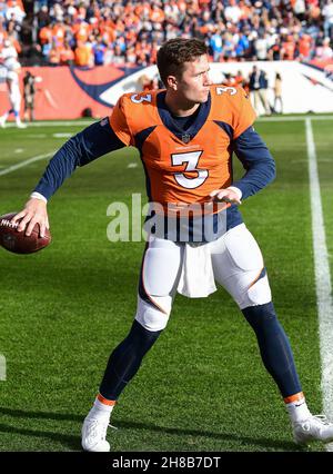 Denver, CO, USA. 28th Nov, 2021. Denver Broncos guard Dalton Risner (66)  signals first down after a strong run by Denver Broncos running back  Javonte Williams (33) in the first half of