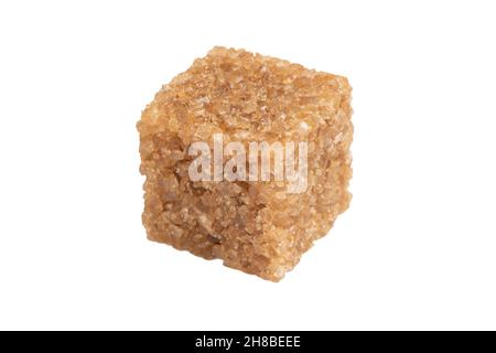 Brown unrefined cane sugar cube isolated on white background. Macro shot refined sugar cube isolated. Stock Photo