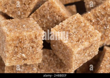 Brown unrefined cane sugar cube texture background. Macro shot refined sugar cube texture pattern Stock Photo