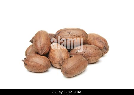 Pecan nuts heaped isolated on white background Stock Photo