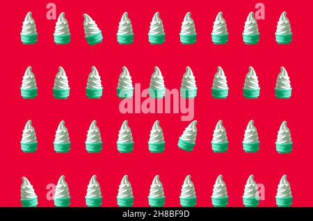 Pop Art Style Mint Green Colored Rows of Soft Serve Ice Cream Cones Pattern on Strawberry Red Backdrop Stock Photo