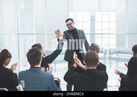 business colleagues giving each other a high five Stock Photo