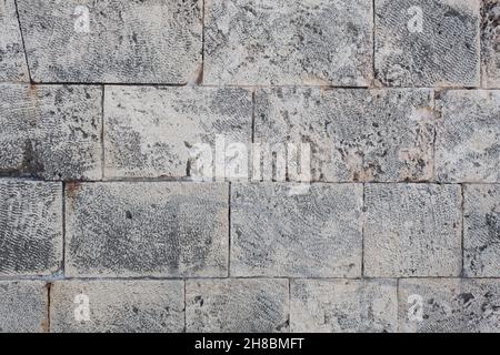 Detail of an old stone wall at the harbor Stock Photo
