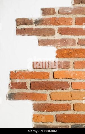 Mix of brick and plaster wall background Stock Photo