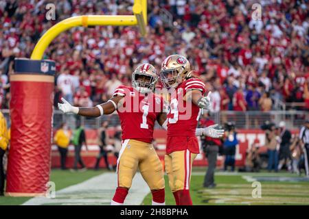 San Francisco 49ers' Talanoa Hufanga and Dontae Johnson break up a