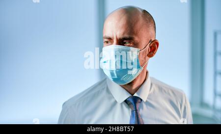 scientist in a protective mask on the background of a medical laboratory. Stock Photo