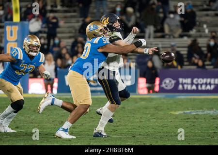 UCLA Bruins defensive lineman Tyler Manoa (50) wraps up California Golden Bears quarterback Chase Garbers (7) as he tries to toss a pass during a NCAA Stock Photo